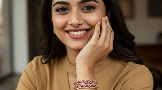 Lifestyle portrait of a confident Indian woman wearing an elegant Feelori CZ and ruby stone bangle with contemporary attire.