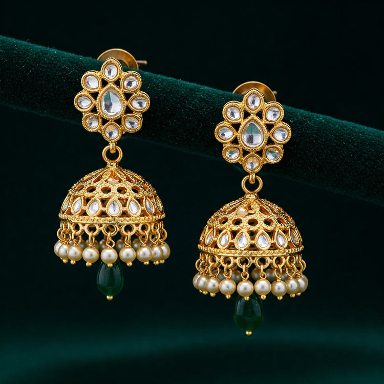 Exquisite close-up photo of beautiful Feelori Jadau Kundan Jhumki earrings showcasing intricate goldwork and Polki stones