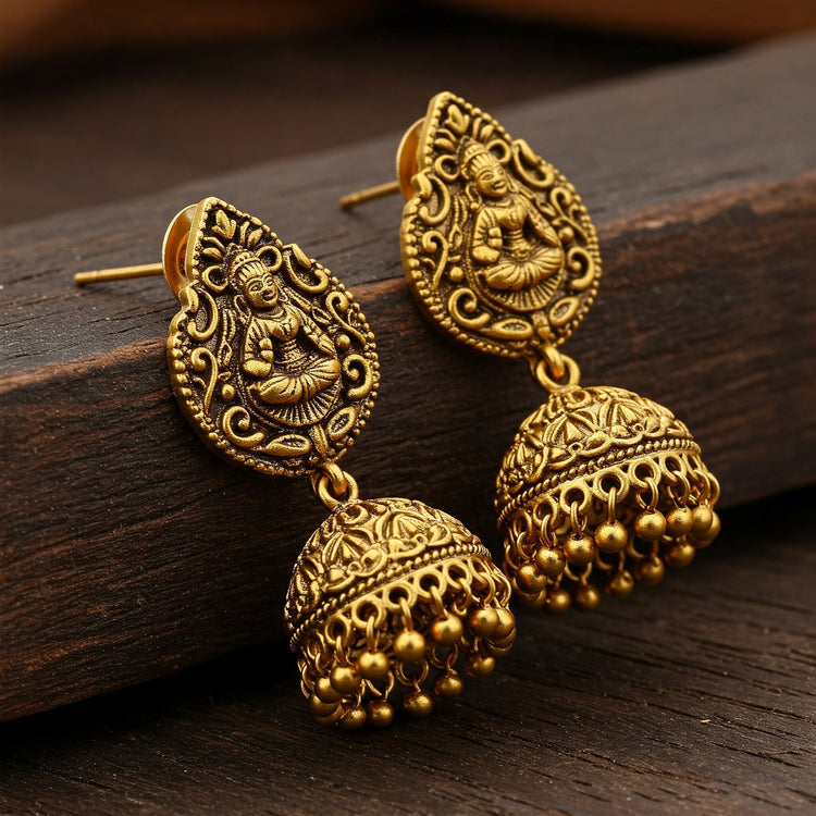 Pair of Feelori Nakshi Matte Hanging Earrings with intricate temple carvings in matte gold finish - traditional Indian jewelry.