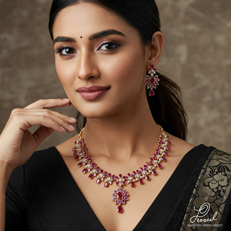 Model wearing a modern Feelori ruby-colored necklace and earring set featuring marquise-cut stones and floral motifs.