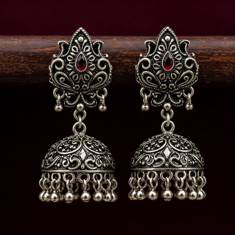 Detailed close-up of Feelori Victorian Mehendi Jhumka earrings showcasing intricate fusion patterns and an antique finish.