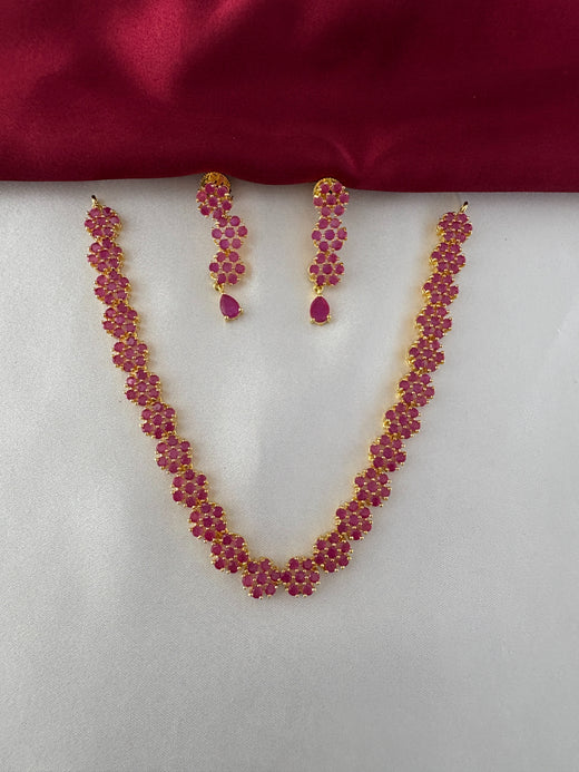 FeelOri Gold Plated Ruby Floral Strand Jewelry Set - Front view showcasing the complete necklace and matching earrings with delicate ruby flower clusters.