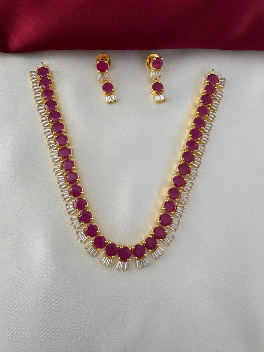 FeelOri Gold Plated Ruby Baguette Choker Set - Main view showcasing the necklace with circular ruby hued stones and baguette clear stones alongside matching earrings.