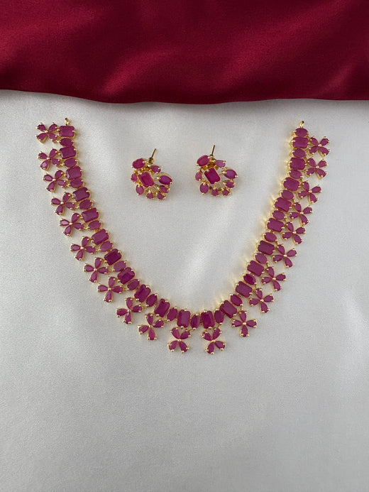 FeelOri Gold Plated Ruby Petal Necklace Set - Front view showcasing the full necklace and matching earrings with their unique stone arrangements.