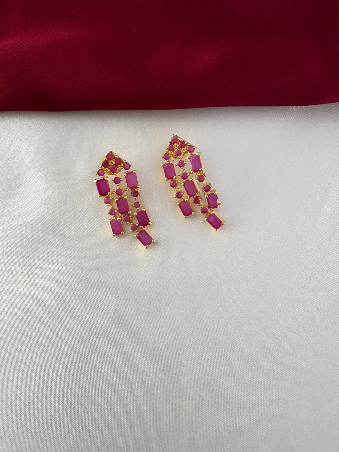 FeelOri Gold Plated Ruby Drop Kundan Earrings - Detailed view of the matching push-back earrings with geometric ruby stone arrangement.
