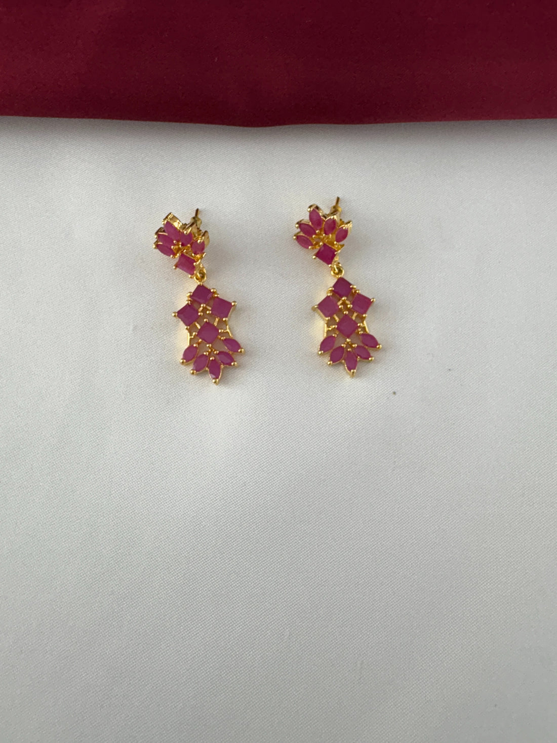 FeelOri Gold Plated Ruby Petal Cluster Earrings - Close-up view highlighting the intricate stone setting and golden detailing.