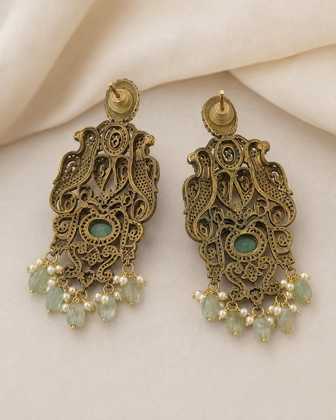FeelOri emerald earrings rear view showing openwork reverse, straight posts, and push-back closures