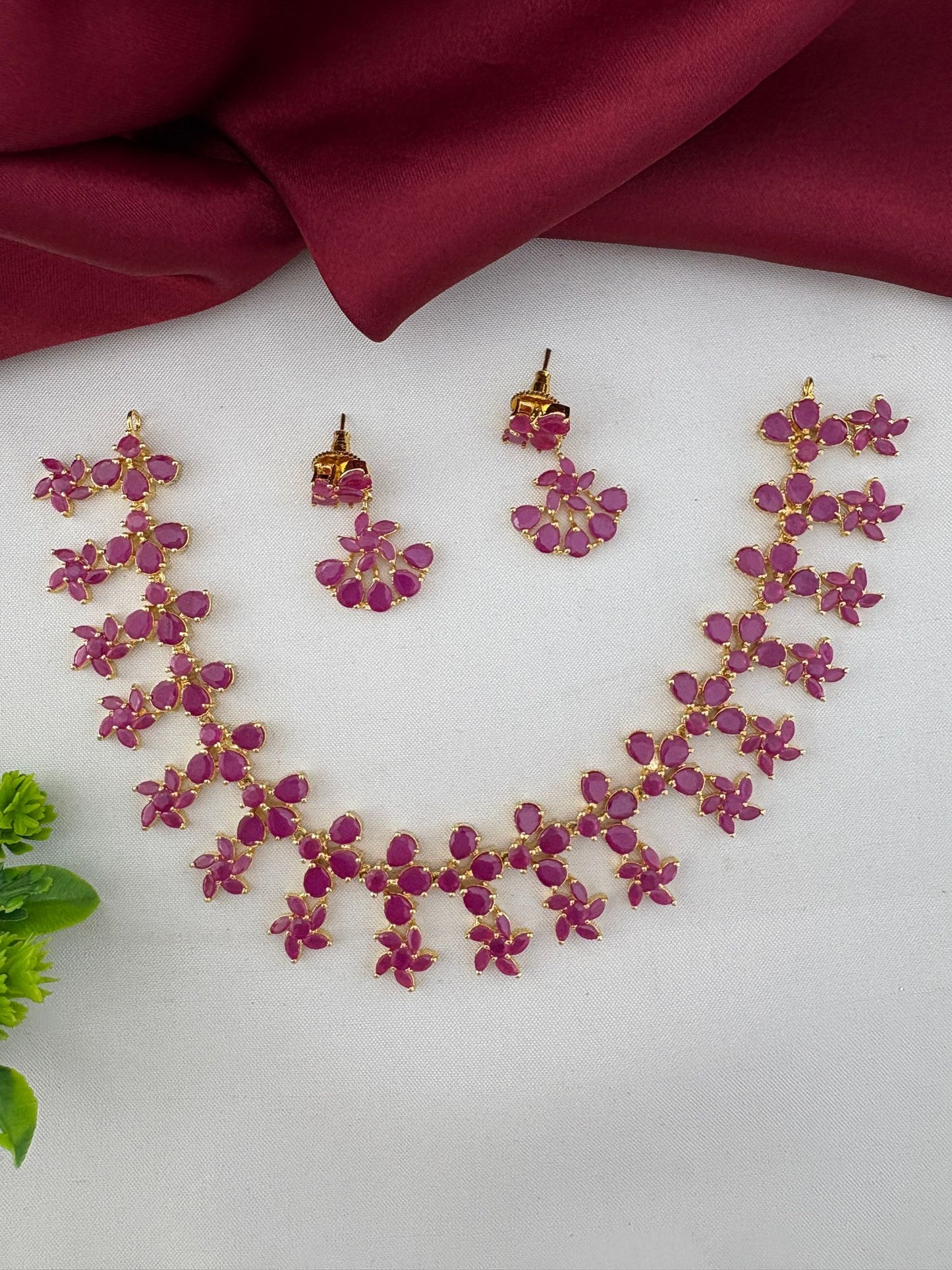Alternative view of the FeelOri Antique Finish Original Ruby Short Necklace Set. Shows the lay of the ruby necklace and accompanying earrings.