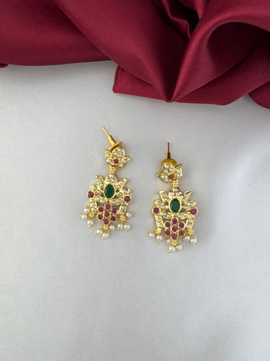 Detailed close-up of the FeelOri Aura of Elegance earrings, showcasing ruby, emerald, and pearl design - part of the Subtle Luxury necklace set by FeelOri.