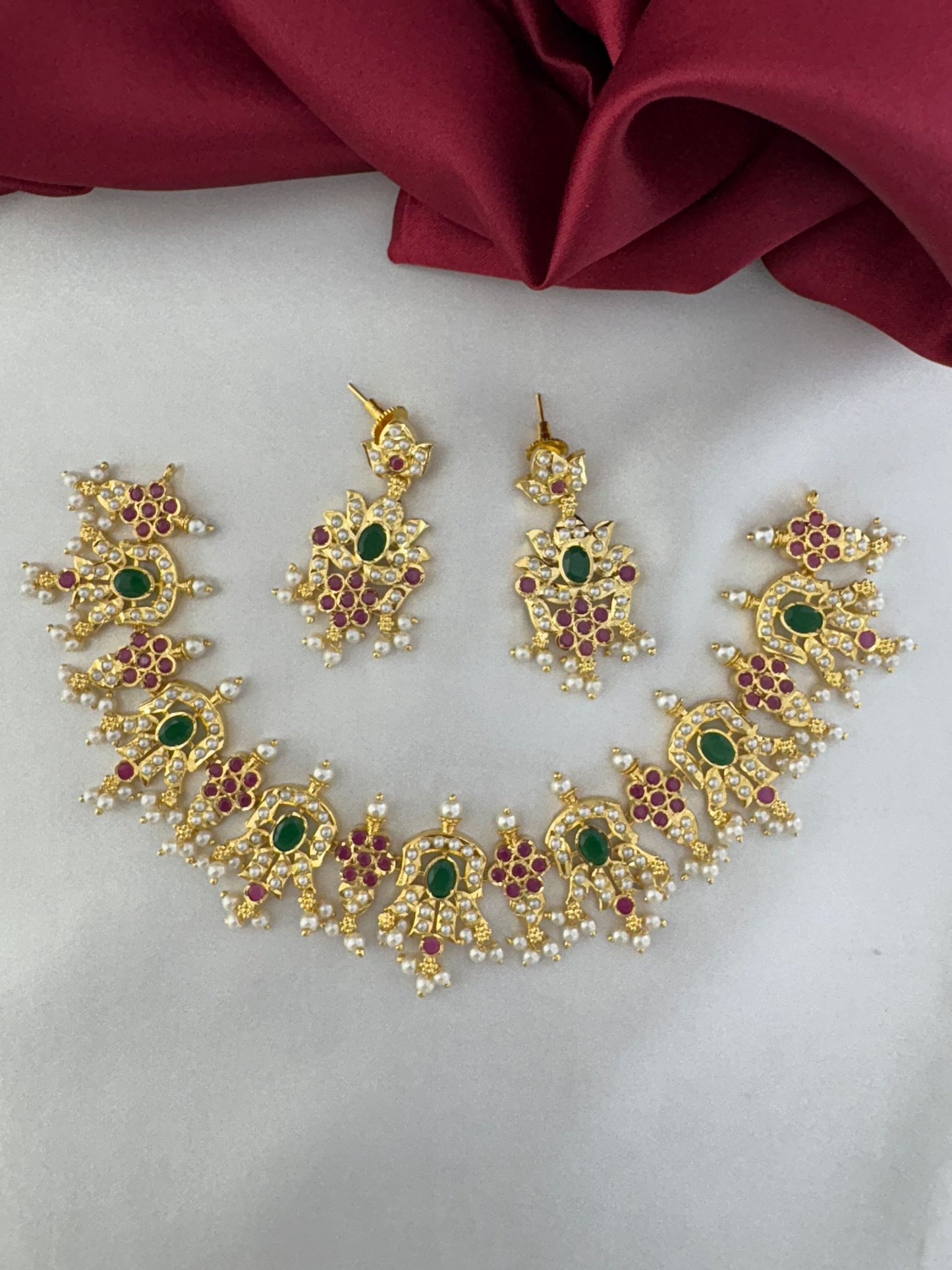 FeelOri Aura of Elegance Ruby & Emerald Necklace Set with pearls - Full view of the necklace and matching earrings by FeelOri.