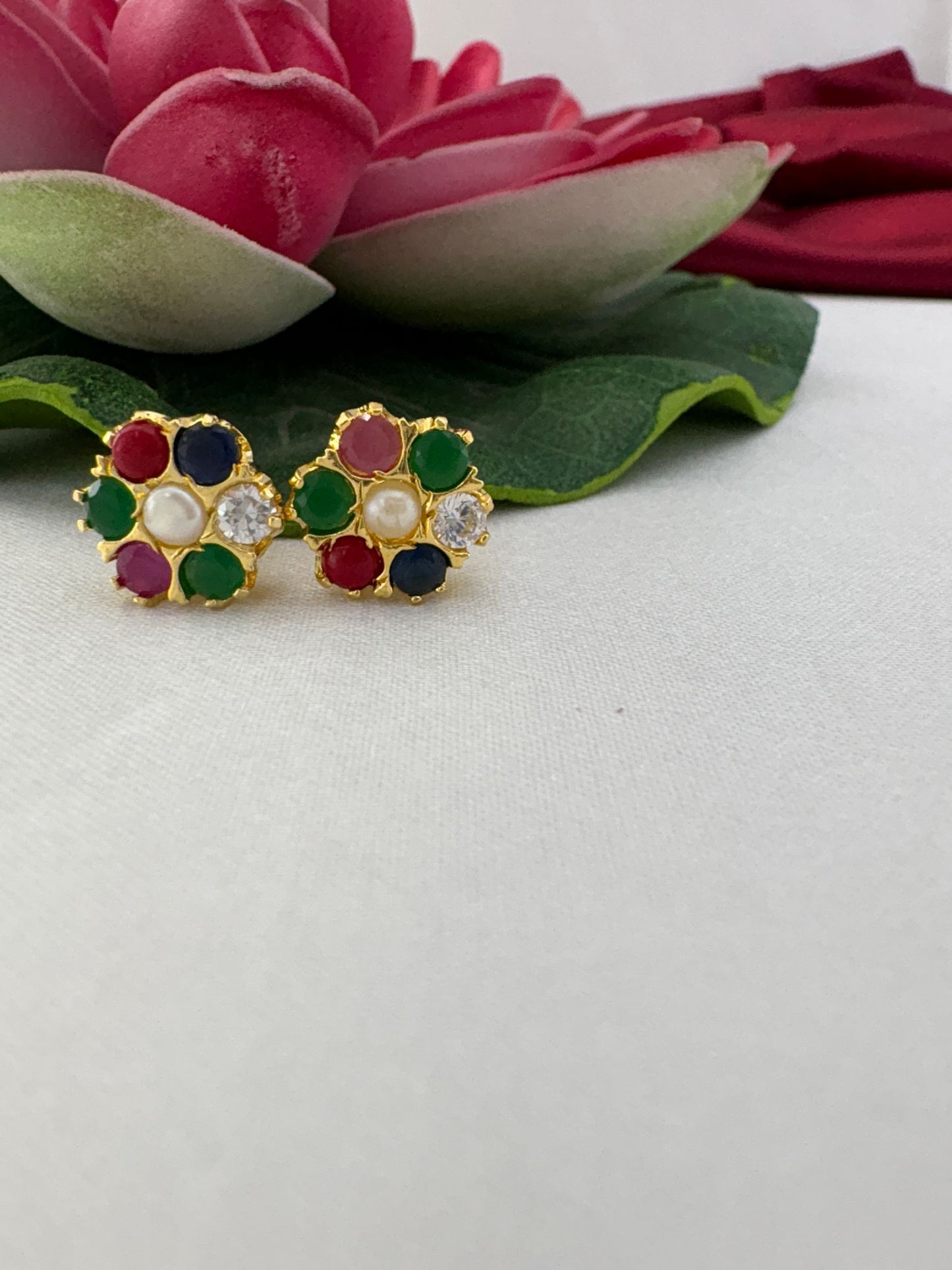 FeelOri Auspicious Navaratna AD stud earrings side view showing gold post construction and secure back mechanism
