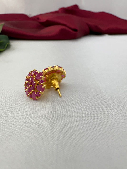 FeelOri Berry Sorbet medium cool pink AD stud earrings angled view displaying gold post and secure back mechanism