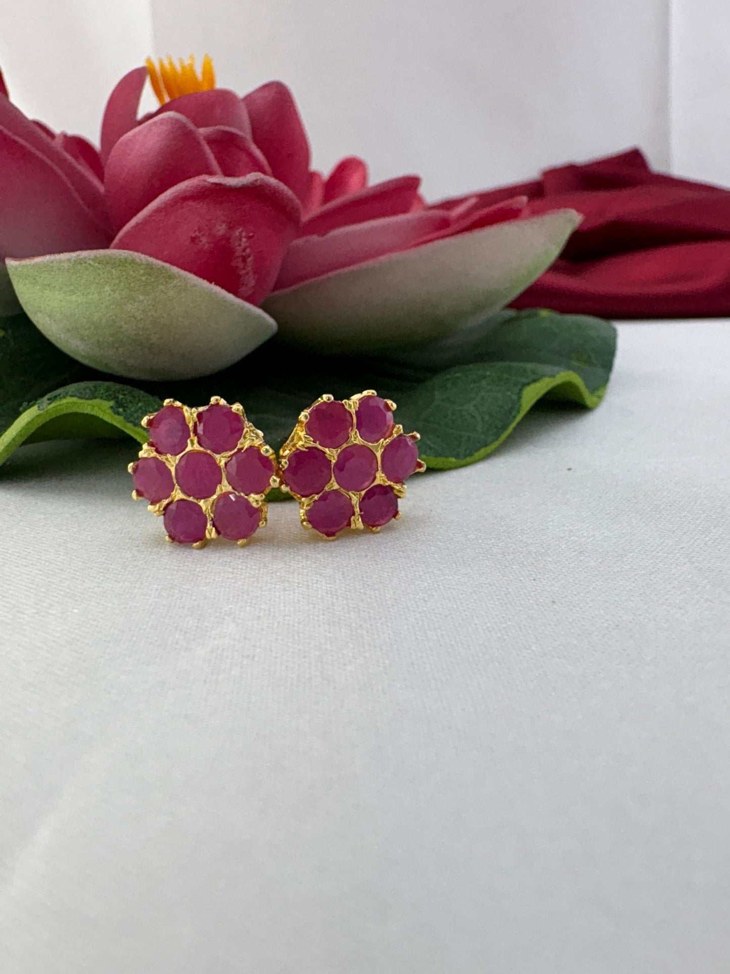 FeelOri bright fuchsia flash AD studs styled with lotus creating electric contemporary bold fashion statement