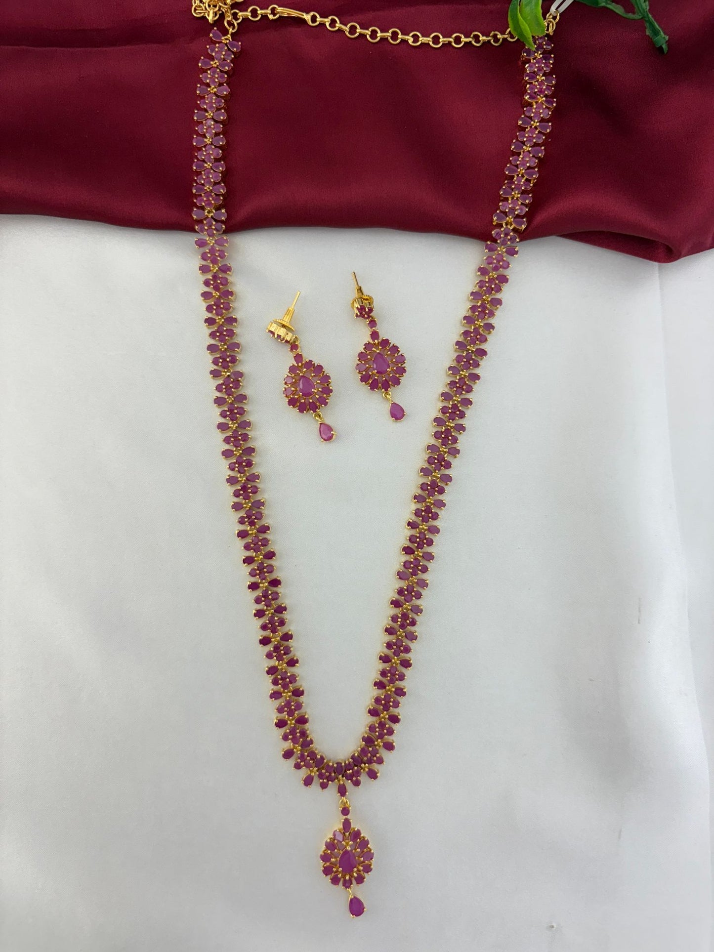 FeelOri Celestial Fire Ruby & AD Halo Long Necklace & Earring Set - Angled full view showcasing necklace drape.