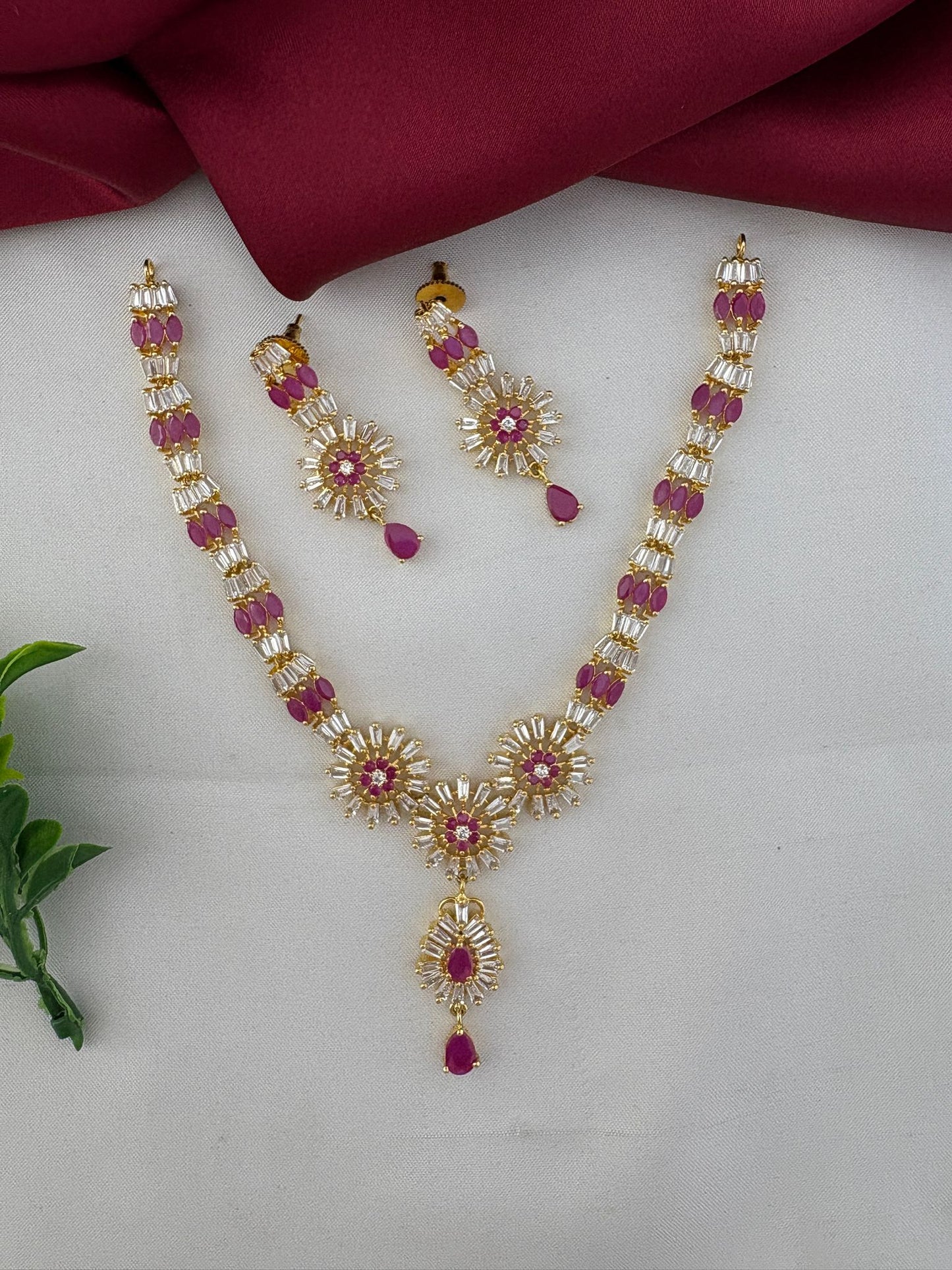 Complete view of the FeelOri Divine Original Ruby Short Necklace Set from the Temple Collection by FeelOri, showcasing the stone arrangement and gold-tone finish.