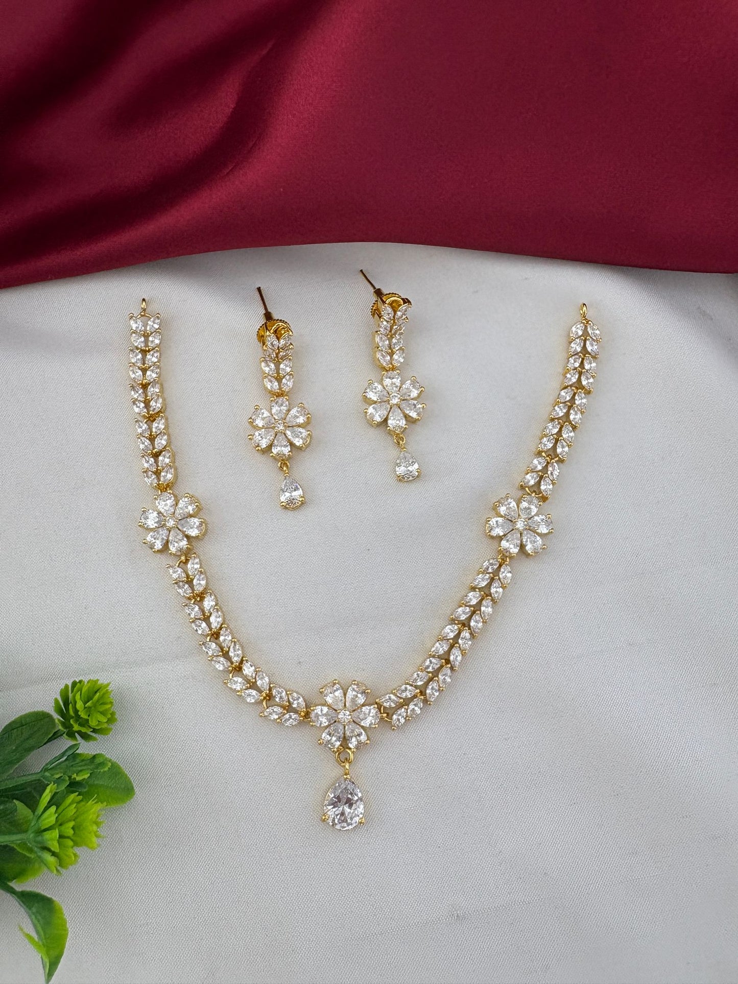 FeelOri Everyday Elegance AD Stone Pendant Short Necklace Set with decorative green foliage