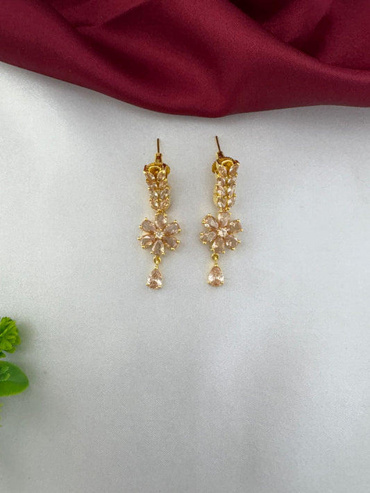 Close-up of FeelOri Festive Sunbeam Gold AD Stone floral drop earrings.