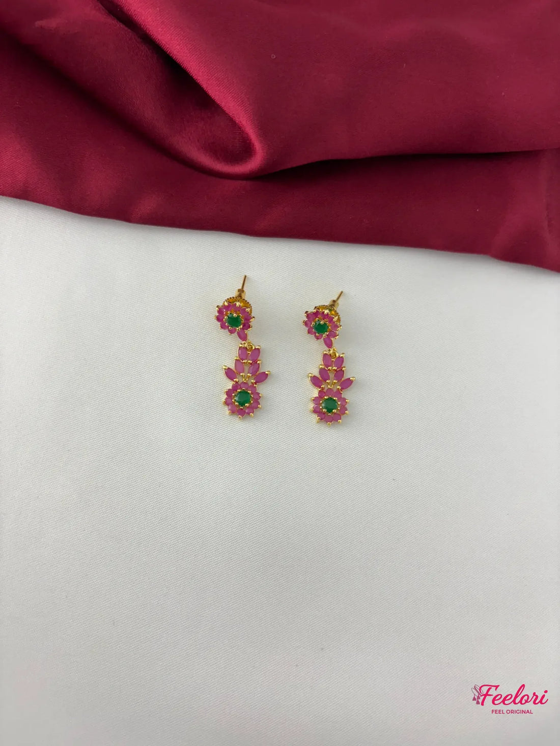 FeelOri Gold Plated Ruby Emerald Earrings - Close-up view highlighting the intricate floral petal design and Ruby CZ and emerald stones.
