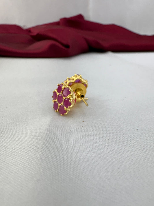 FeelOri Fuchsia Flash bright pink AD stud earrings angled view displaying gold post mechanism and secure back