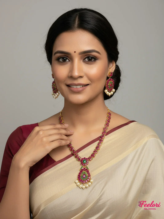 FeelOri Gold Plated Ruby Emerald Floral Necklace Set - Model wearing set with traditional Indian saree