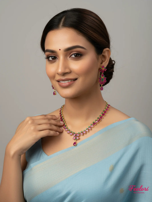 FeelOri Gold Plated Ruby Emerald Floral Petal Drop Necklace Set - Model wearing delicate chain with traditional saree.