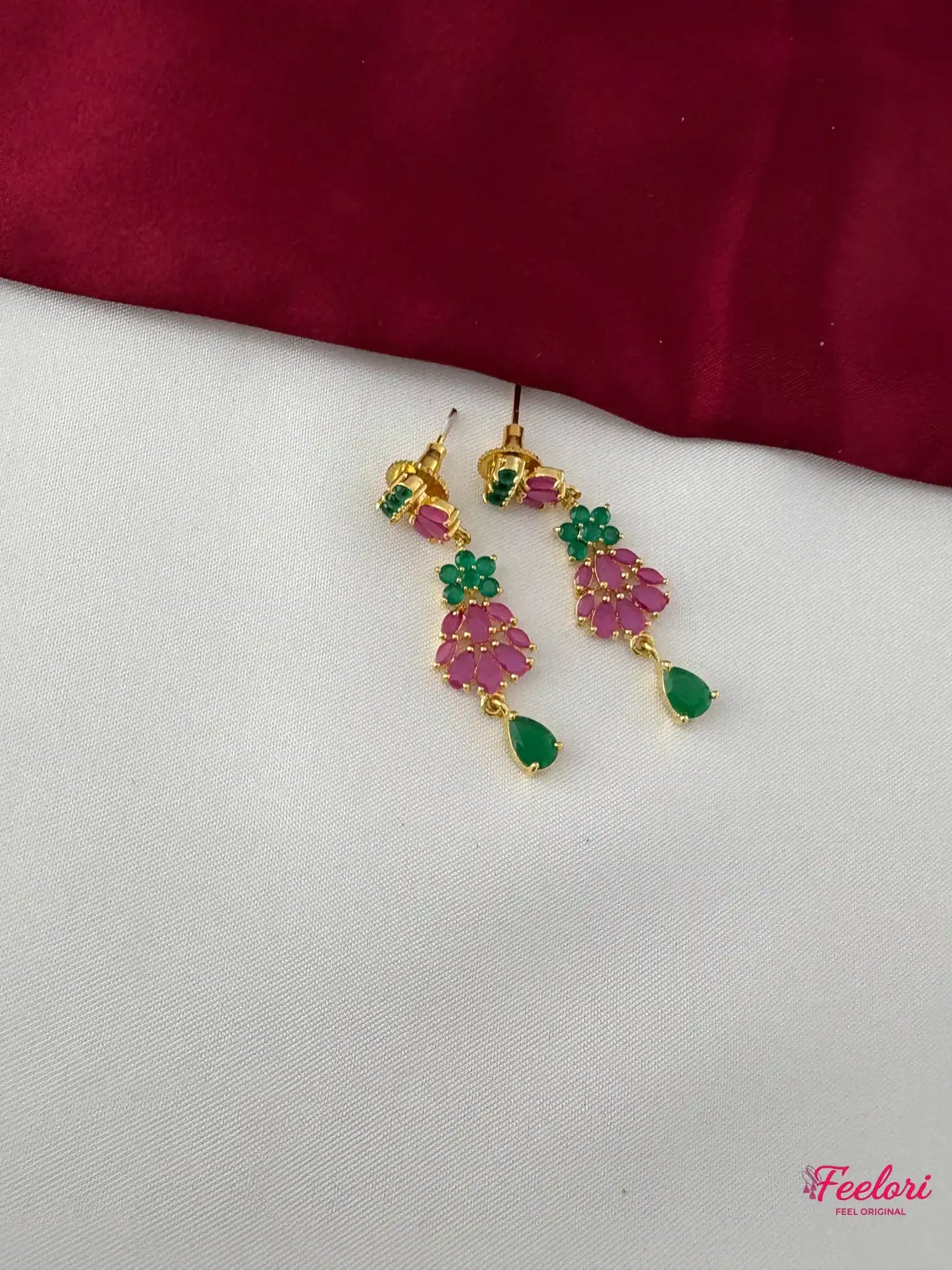 FeelOri Gold Plated Ruby Emerald Floral Petal Drop Earrings - Close-up view highlighting the detailed emerald and ruby petal clusters and the emerald teardrop accent.