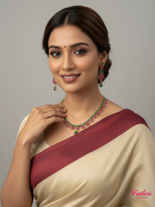 FeelOri Gold Plated Ruby Emerald Necklace Set - Model wearing floral design with traditional saree.