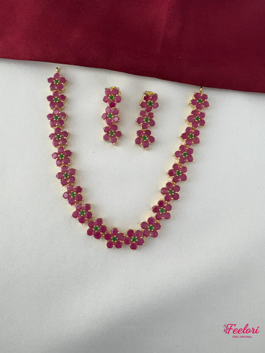 FeelOri Gold Plated Ruby Emerald Flower Chain Necklace Set - Full view displaying the intricate floral clusters on the necklace and matching earrings.