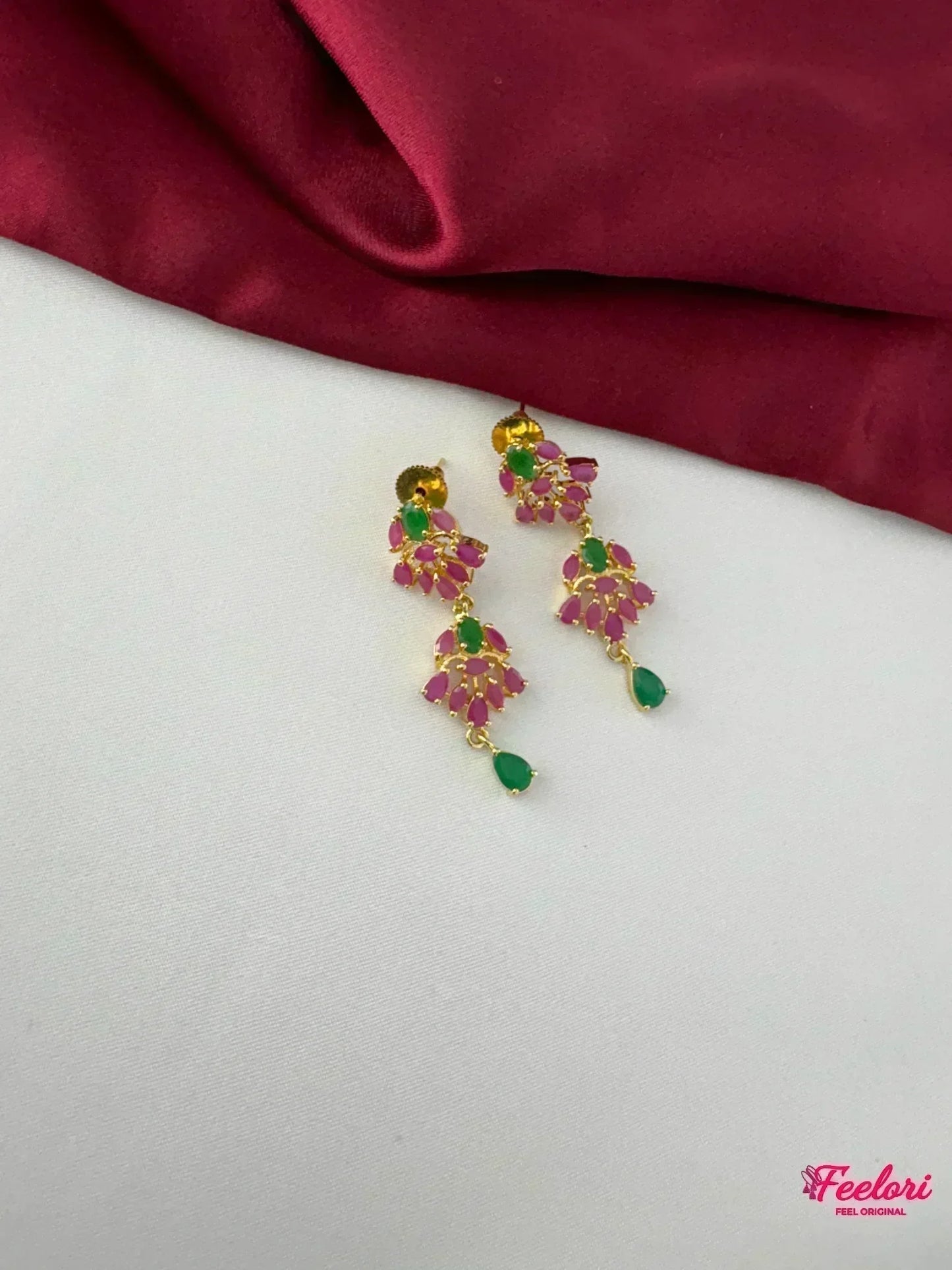 FeelOri Gold Plated Ruby Emerald Earrings - Detailed view of the matching earrings with teardrop emerald accent and floral ruby clusters.