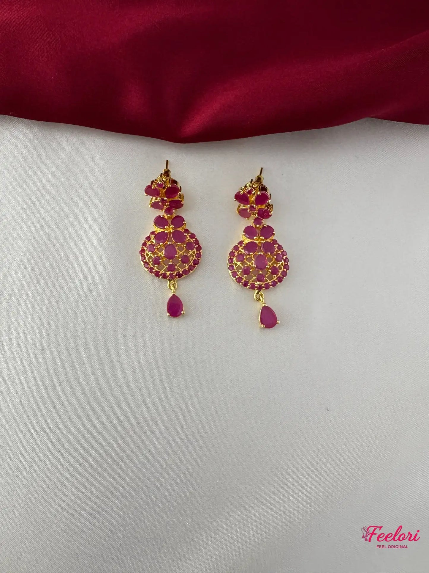 FeelOri Gold Plated Ruby Floral Earrings - Close-up view highlighting the detailed floral pattern and tear-drop ruby stone.