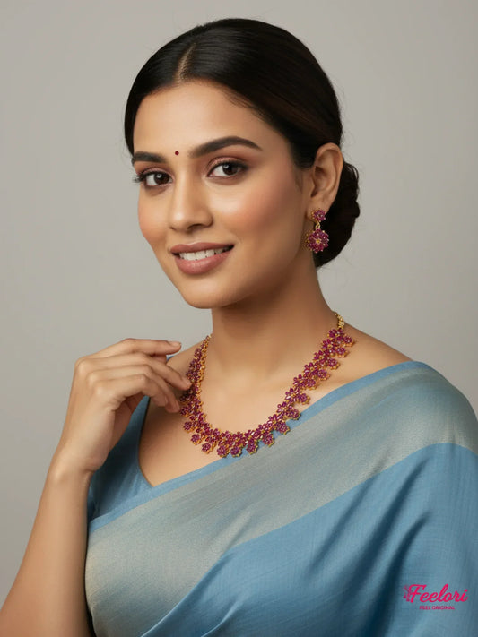 FeelOri Gold Plated Ruby Floral Necklace Earring Set - Model wearing set with elegant blue saree.