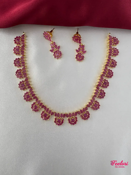 FeelOri Gold Plated Ruby Marquis Necklace Set - Front view showcasing the complete necklace and matching earrings with intricate petal clusters.