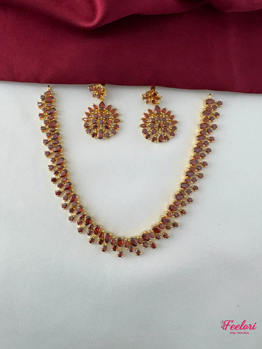 FeelOri Gold Plated Ruby Petal Cluster Necklace Set - Front view showcasing the radiant cascade design with Ruby-Tone CZ gemstones.