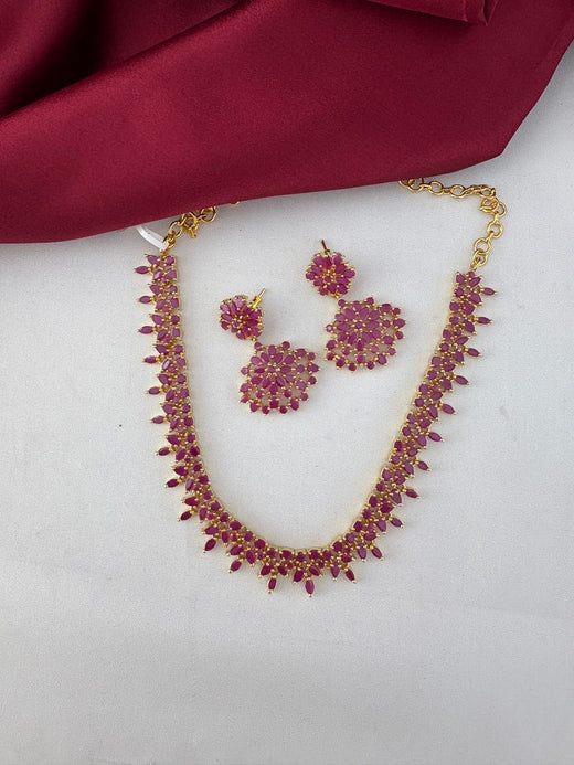 Feelori Gorgeous Ruby-Tone CZ Short Necklace Set with matching earrings, elegant design for Coimbatore Celebrations, clear top view.