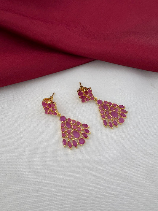 Close-up of FeelOri Majestic ruby earrings, part of the short necklace set for Kerala receptions. Detailed stone work by FeelOri.
