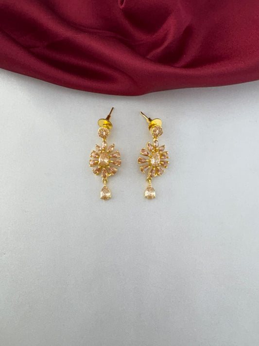 Detailed close-up of the earrings from the FeelOri Modern Aura Gold AD Geometric Short Pendant Set, highlighting the stone-studded floral pattern and drop stone.