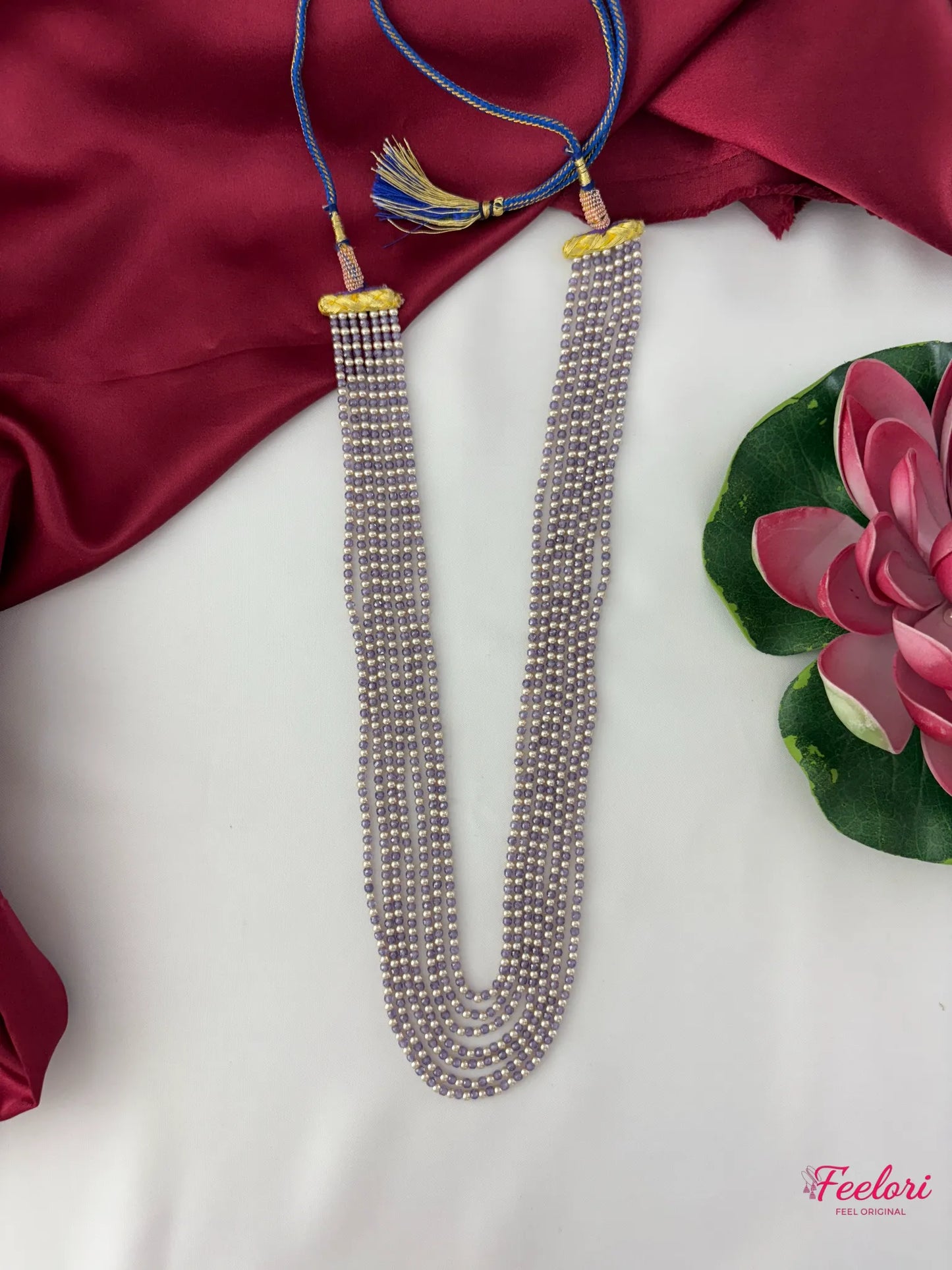 FeelOri Mother of Pearls Multi-Strand Mala - Close-up of the adjustable blue dori and gold-tone tassels with CZ stone embellishments.