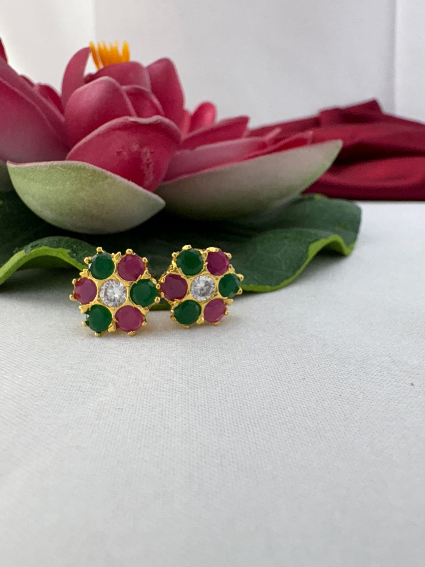 FeelOri mystic garden earthy jewel tone AD studs styled with lotus creating enchanted forest magical appeal