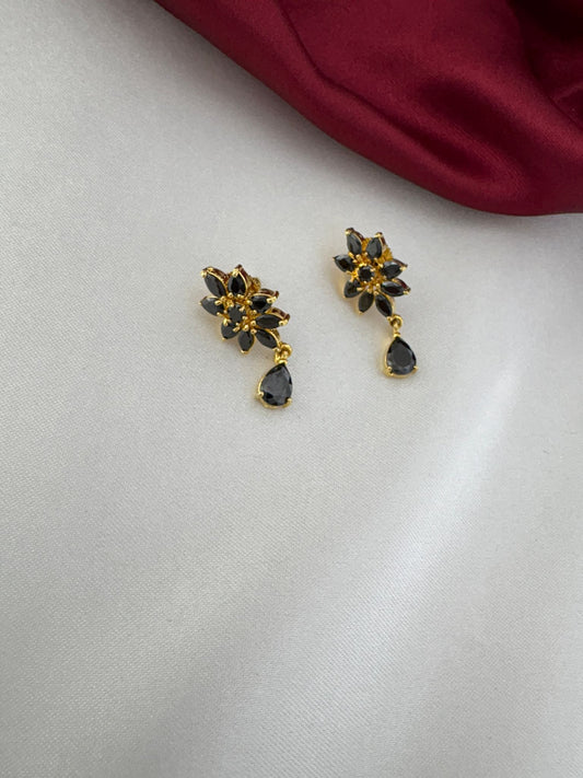 Close-up of FeelOri Noir Elegance Black AD Solitaire Earrings, highlighting the intricate floral design with black stones and a teardrop dangle by FeelOri.