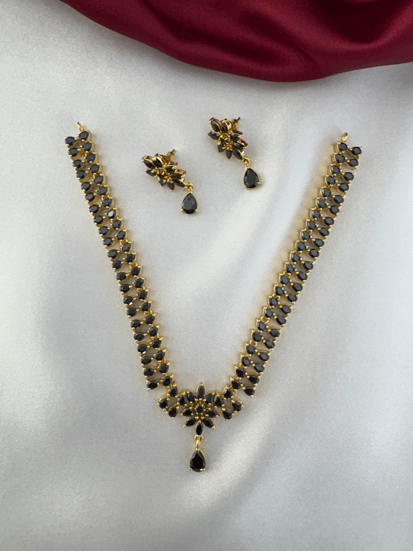 FeelOri Noir Elegance Black AD Solitaire Short Pendant Necklace and Earrings set displayed together, showcasing the complete jewellery ensemble by FeelOri.