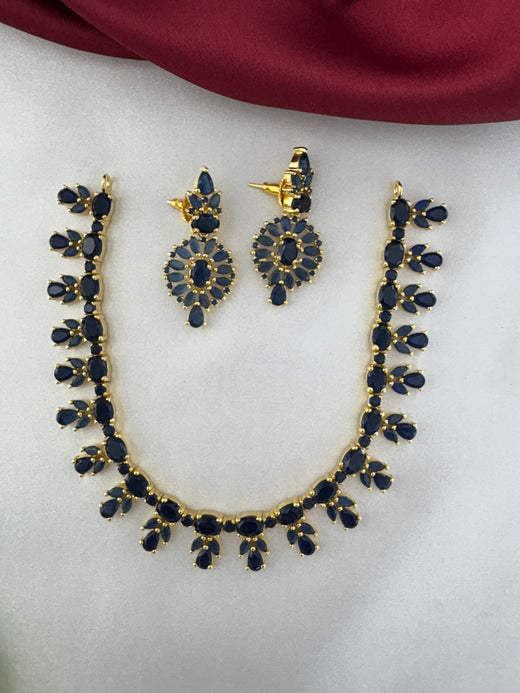 FeelOri Oceanic Serenity Blue AD Drop Short Necklace and Earrings Set displayed on a light fabric background.