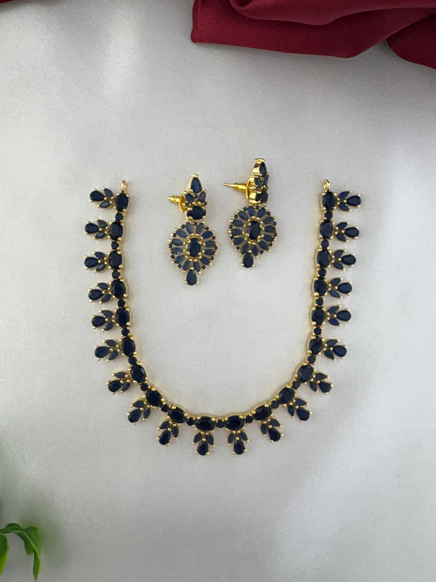 Styled view of the FeelOri Oceanic Serenity Blue AD Drop Short Necklace and matching Earrings.