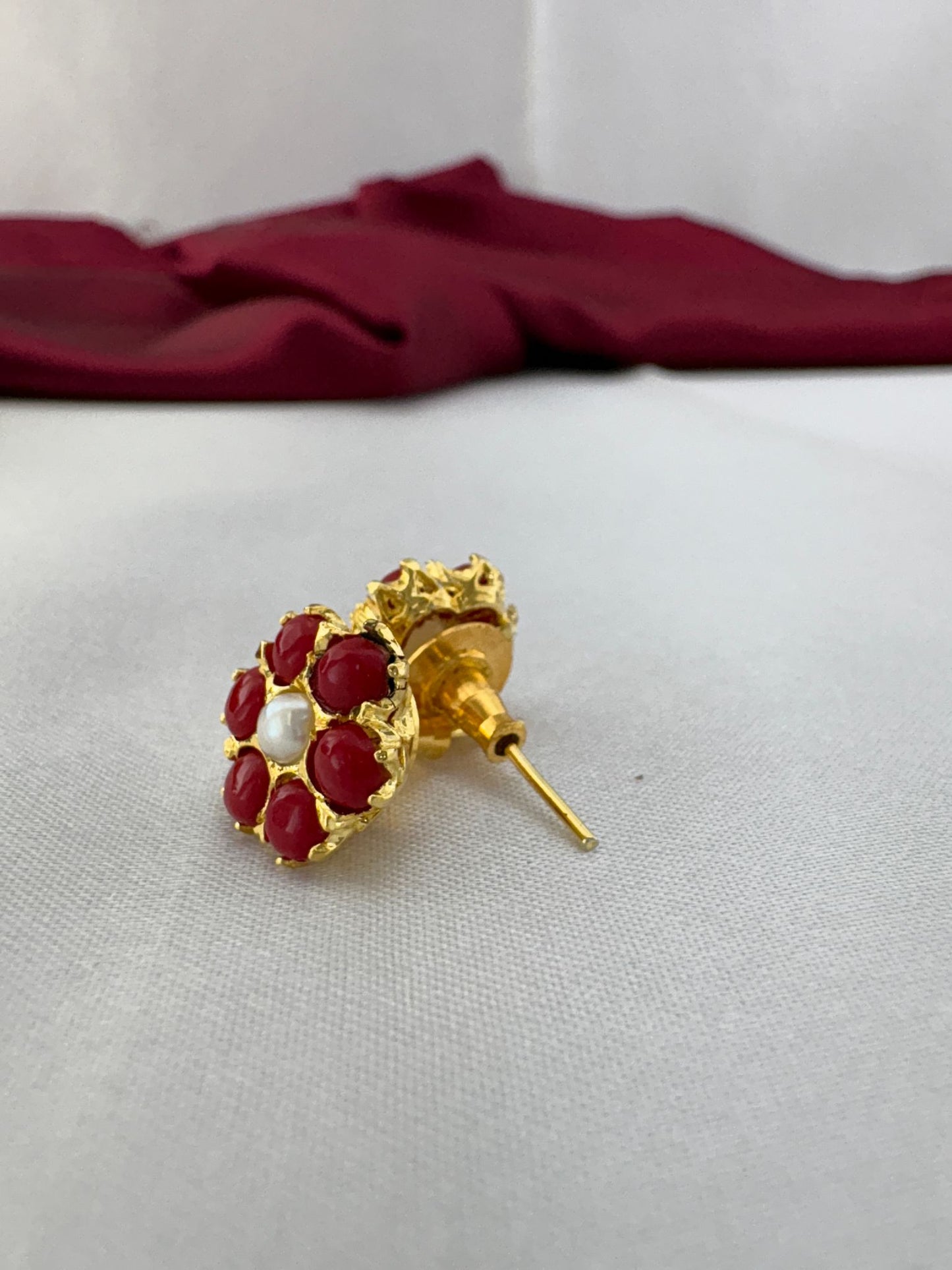 FeelOri Passionate Ruby Hue red AD stud earrings side angle showing gold post construction and premium back fitting