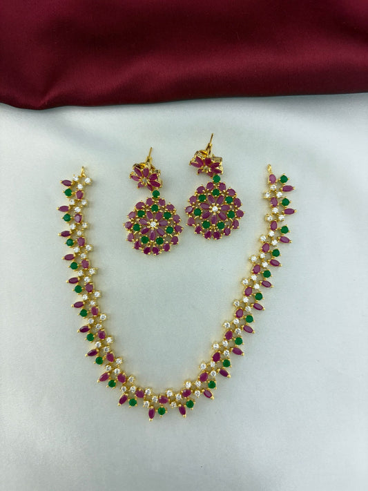 FeelOri Rainbow Sparkle Multi-Color AD Short Necklace and Earrings set displayed on fabric - front view.