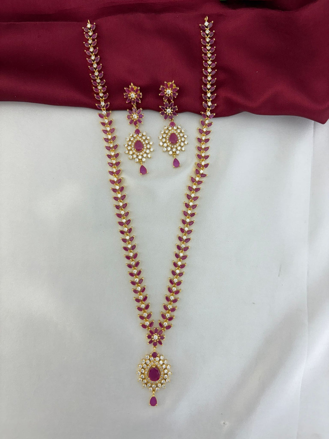 Full view of the FeelOri Regal Ruby Bloom AD Cluster Long Necklace & Earring Set.