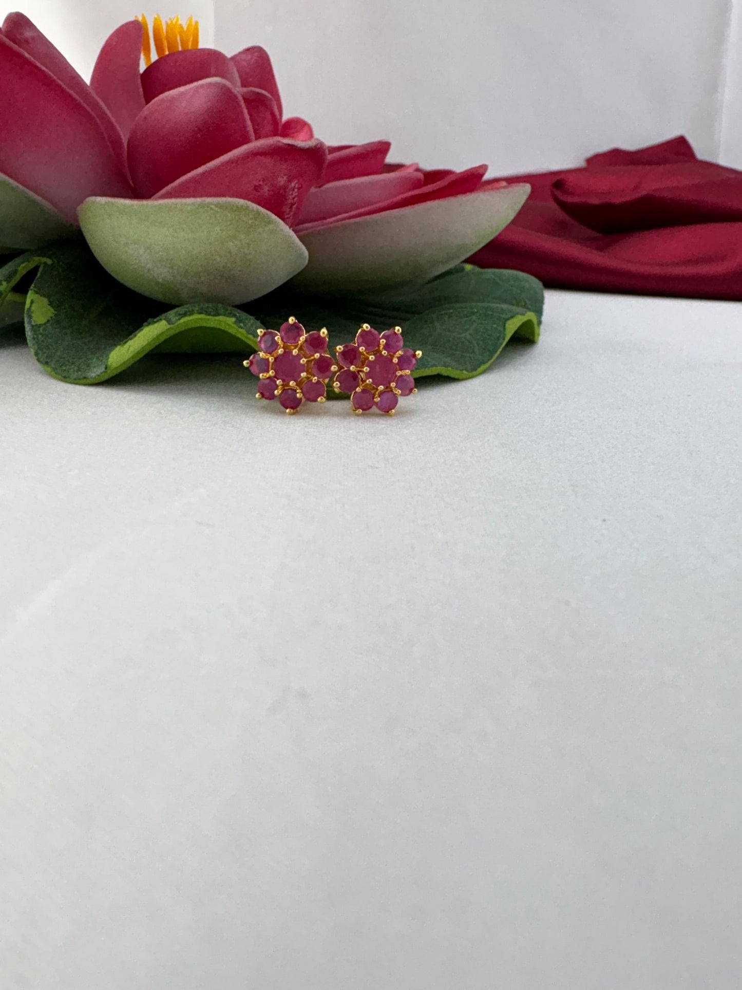 FeelOri rose quartz pale pink AD studs styled with lotus creating ethereal translucent gemstone healing appeal