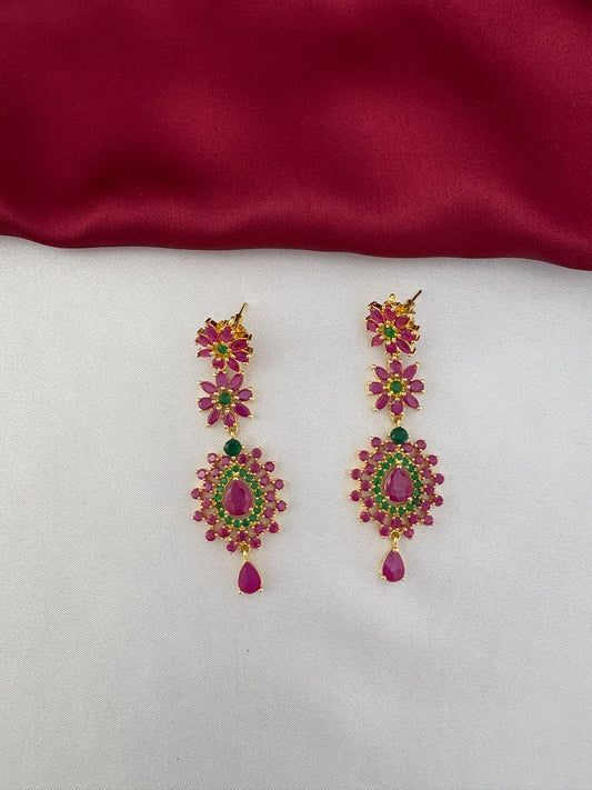 Close-up detail of the FeelOri Royal Garden Ruby & Emerald Floral Earrings.