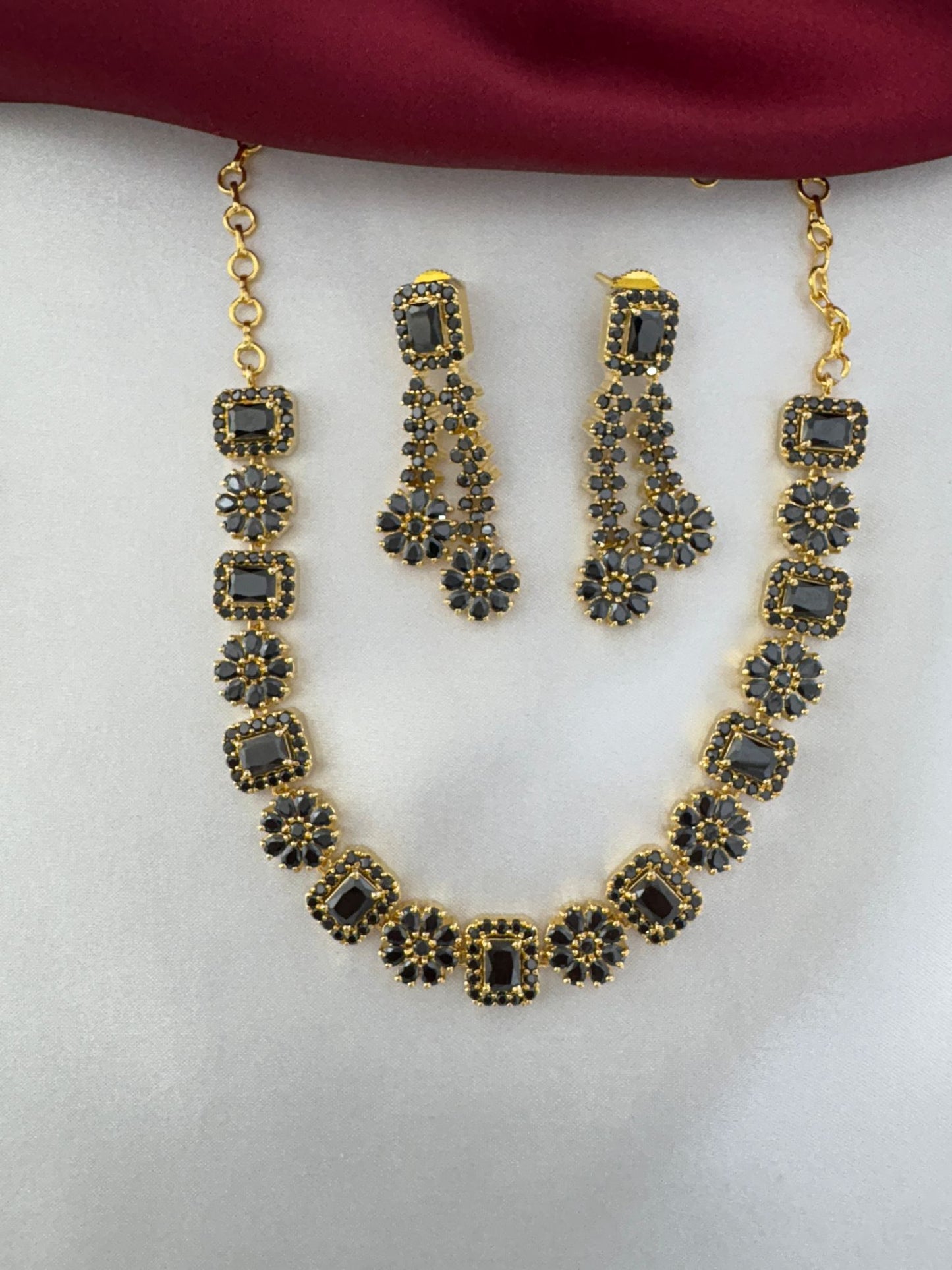 FeelOri Shadow Bloom Black AD Floral Short Necklace Set by feelori - hanging display.