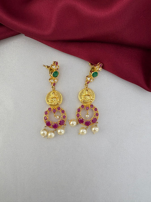 Close-up of FeelOri Sunset Hues Multi-Color AD earrings. Detailed view of gold-plated earrings with red, green, and white AD stones and pearl drops by feelori.