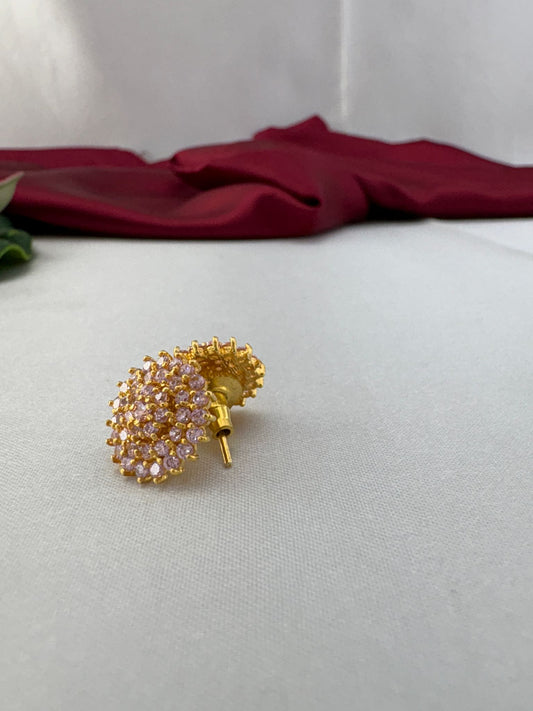 FeelOri Sweetheart baby pink AD stud earrings angled view displaying gold post and earring back details